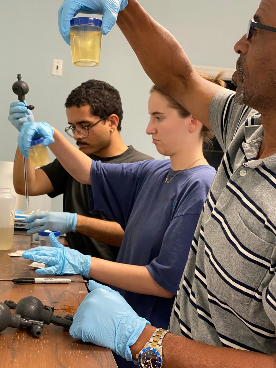 PIN interns conducting an experiment